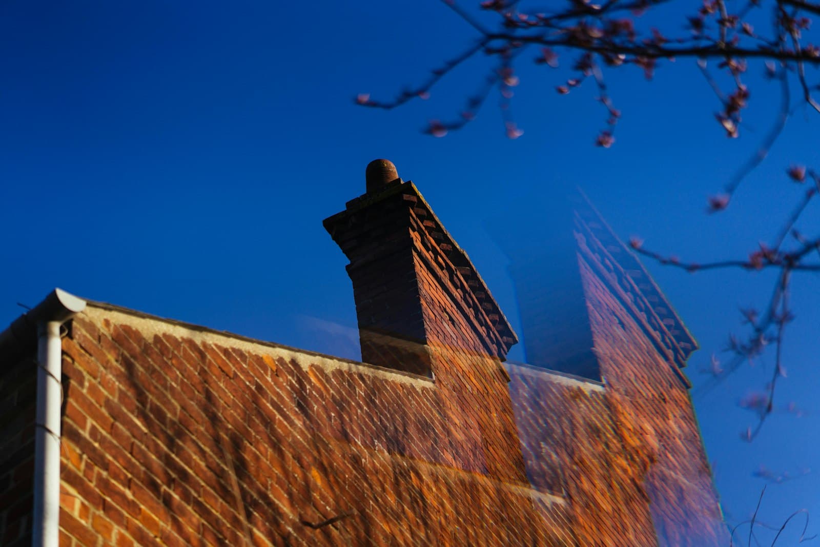 A brick chimney stack on a roof in Leeds